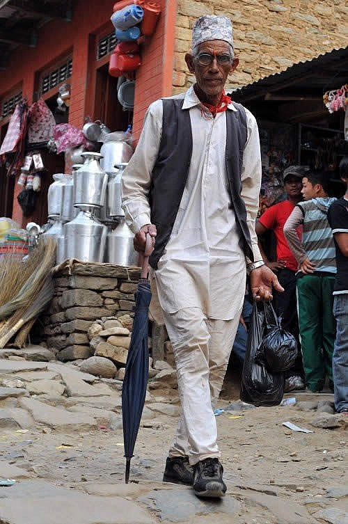 A businessman in the busy market town of Arughat